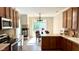 Charming kitchen featuring a breakfast nook, fireplace, and stainless steel appliances at 12551 Hawks Landing Dr, Fishers, IN 46037