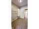 Functional laundry room featuring tile floors and built-in shelving at 12551 Hawks Landing Dr, Fishers, IN 46037