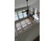 Bright living room with hardwood floors, fireplace, and large windows for natural light at 12551 Hawks Landing Dr, Fishers, IN 46037