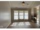 Bright living room featuring hardwood floors, neutral paint, a ceiling fan, fireplace and natural light at 12551 Hawks Landing Dr, Fishers, IN 46037