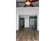 Open-concept living area with wood floors and direct view into front entry at 12551 Hawks Landing Dr, Fishers, IN 46037