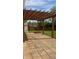 Spacious brick patio featuring a pergola, perfect for outdoor entertaining and relaxation at 12551 Hawks Landing Dr, Fishers, IN 46037