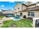 Spacious backyard with outdoor seating, dining area, and a lush lawn at 12984 Shandon Ln, Fishers, IN 46038
