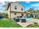 The backyard features a patio with outdoor seating and a well-maintained lawn perfect for relaxing and entertaining at 12984 Shandon Ln, Fishers, IN 46038