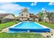 Lush backyard with a pristine pool, inviting lounge areas, and beautifully landscaped surroundings at 12984 Shandon Ln, Fishers, IN 46038