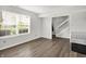 Bright basement featuring gray walls, wood-look floors, and a staircase at 12984 Shandon Ln, Fishers, IN 46038