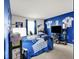 Bedroom featuring Indianapolis Colts decor and blue walls at 12984 Shandon Ln, Fishers, IN 46038