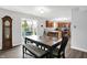 Dining room with table and chairs, flowing into a kitchen with stainless steel appliances at 12984 Shandon Ln, Fishers, IN 46038