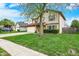 Traditional two-story home boasting a two-car garage and lush green lawn at 12984 Shandon Ln, Fishers, IN 46038