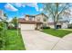 Charming two-story house featuring an attached garage and a neatly paved driveway at 12984 Shandon Ln, Fishers, IN 46038