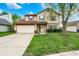 Inviting two-story home with a well-maintained lawn and attached two-car garage at 12984 Shandon Ln, Fishers, IN 46038