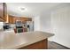 Efficient kitchen featuring stainless appliances, wood cabinets, and neutral countertops at 12984 Shandon Ln, Fishers, IN 46038