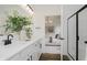 Elegant bathroom with double vanity and view to the main bedroom offers ample space, stylish features, and relaxation at 13324 Roundtop Rd, Noblesville, IN 46060
