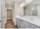 Bright bathroom with double sinks, cabinets, and a large mirror at 13324 Roundtop Rd, Noblesville, IN 46060
