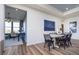 Bright dining area features modern decor, a sleek table set, and stylish artwork at 13324 Roundtop Rd, Noblesville, IN 46060