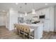 Stylish kitchen features white cabinetry, stainless steel appliances, and a central island with seating at 13324 Roundtop Rd, Noblesville, IN 46060