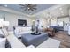 Open-concept living space with modern kitchen, dining area, and comfortable seating arrangement at 13324 Roundtop Rd, Noblesville, IN 46060