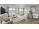 Bright living room with large windows, stylish furniture, and elegant decor at 13324 Roundtop Rd, Noblesville, IN 46060
