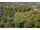 Aerial view of community dog park surrounded by walking trails, woods, and single Gathering homes at 13355 Seven Springs Ln, Noblesville, IN 46060