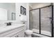 Modern bathroom featuring a vanity with granite countertop and black framed shower at 13355 Seven Springs Ln, Noblesville, IN 46060
