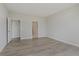 Spacious bedroom boasts wood floors and multiple doorways for easy access to other areas at 13355 Seven Springs Ln, Noblesville, IN 46060