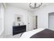 Bright bedroom featuring recessed lighting, a decorative chandelier, neutral colored walls, and a closet at 13355 Seven Springs Ln, Noblesville, IN 46060