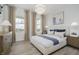 Bright bedroom with large windows, elegant decor, and a stylish bed with blue accents at 13355 Seven Springs Ln, Noblesville, IN 46060