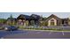 Beautiful building exterior featuring multiple entrances, covered drive through, and beautiful landscaping at 13355 Seven Springs Ln, Noblesville, IN 46060