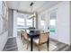 Contemporary dining room with modern lighting, comfortable seating, and views of the outdoors at 13355 Seven Springs Ln, Noblesville, IN 46060