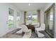 Bright dining area with outdoor views and stylish decor at 13355 Seven Springs Ln, Noblesville, IN 46060