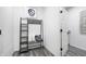 Modern entryway with stylish storage bench, decorative pillows, and clean, minimalist design at 13355 Seven Springs Ln, Noblesville, IN 46060