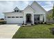 Charming two-story home with a well-manicured lawn and a two-car garage at 13355 Seven Springs Ln, Noblesville, IN 46060