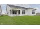 New construction home featuring white siding and a well-manicured lawn at 13355 Seven Springs Ln, Noblesville, IN 46060