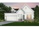 Charming modern farmhouse featuring white siding, stone accents, and a two-car garage at 13355 Seven Springs Ln, Noblesville, IN 46060