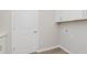 Laundry room equipped with hookups, cabinets, and a door for convenient access at 13355 Seven Springs Ln, Noblesville, IN 46060