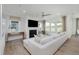 Bright living room with fireplace, multiple windows, and neutral decor at 13355 Seven Springs Ln, Noblesville, IN 46060