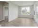 Bright and airy living room with a view to the outdoor patio at 13355 Seven Springs Ln, Noblesville, IN 46060