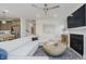 Bright living room features a fireplace, recessed lighting, and an open layout to the modern kitchen at 13355 Seven Springs Ln, Noblesville, IN 46060