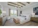 Beautifully staged main bedroom featuring wood beams, a ceiling fan and modern decor at 13355 Seven Springs Ln, Noblesville, IN 46060
