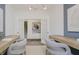 Bright office space featuring french doors, neutral walls, and two work stations at 13355 Seven Springs Ln, Noblesville, IN 46060