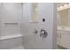 Contemporary shower featuring a built-in bench, niche, and sleek fixtures at 13355 Seven Springs Ln, Noblesville, IN 46060