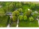 Sprawling property features lush green lawns, mature trees, and multiple buildings offering privacy and space at 1425 E Us Highway 40, Clayton, IN 46118