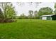 Large lawn with storage shed and plenty of room to enjoy at 1425 E Us Highway 40, Clayton, IN 46118