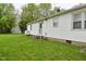 Exterior back of home view with a door and two sets of stairs at 1425 E Us Highway 40, Clayton, IN 46118