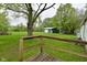 Expansive backyard with a large green storage shed at 1425 E Us Highway 40, Clayton, IN 46118
