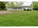Charming single story home with a front porch and spacious lawn at 1425 E Us Highway 40, Clayton, IN 46118