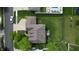 Aerial shot shows a well-kept backyard with an outdoor seating area and a meticulously maintained lawn at 18247 Kinder Oak Dr, Noblesville, IN 46062