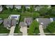 Overhead view of a home with a pool, spacious yard, mature trees, and a neighborhood setting at 18247 Kinder Oak Dr, Noblesville, IN 46062
