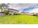 Spacious backyard with lush green grass and a wooden fence, ideal for outdoor activities and relaxation at 18247 Kinder Oak Dr, Noblesville, IN 46062