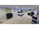 Finished basement offering a bed, gaming area and ambient LED strip lighting at 18247 Kinder Oak Dr, Noblesville, IN 46062